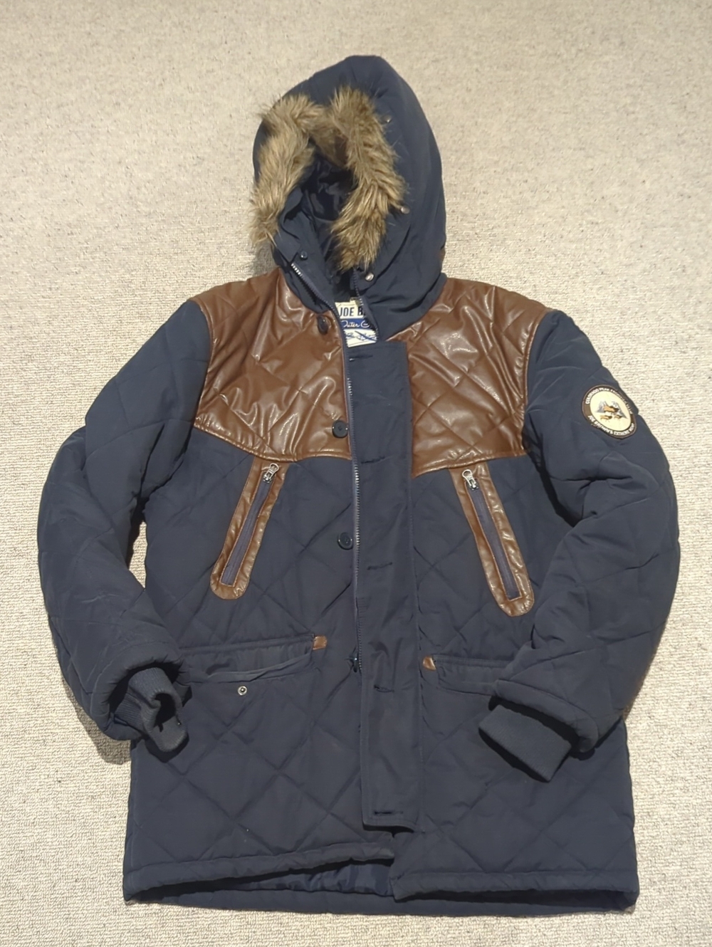 Quilted Navy Puffer Jacket with Brown Trim and Faux-Fur Hood